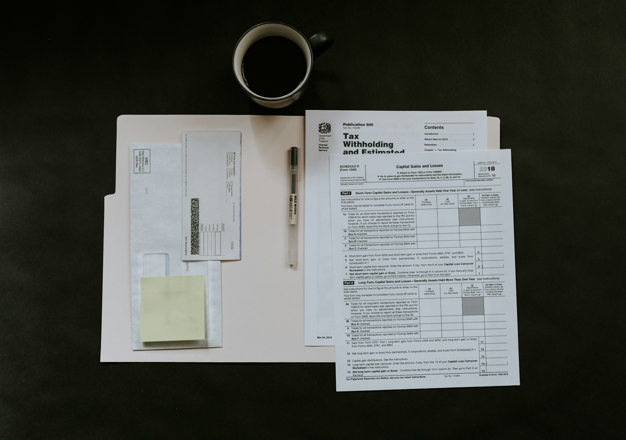 Printed reports and forms laid out on a desk