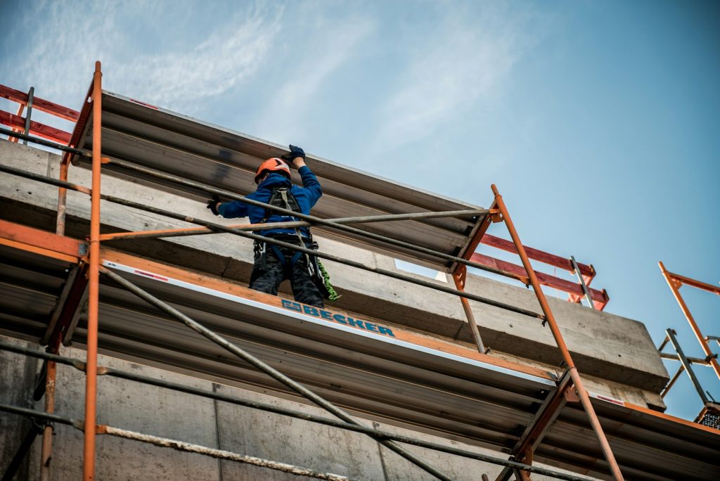 Construction worker on scaffolding at height