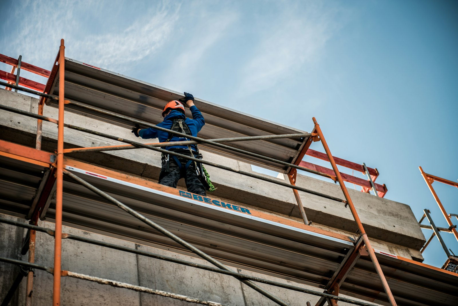 Construction worker on scaffolding at height